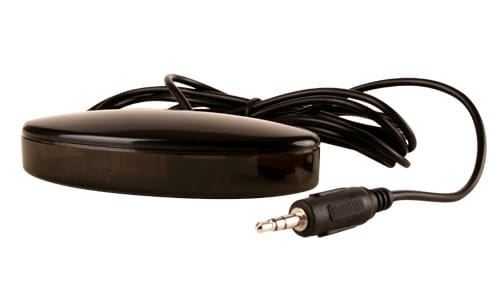 Black tabletop and narrow oval shaped receiver with stereo jack connector attached