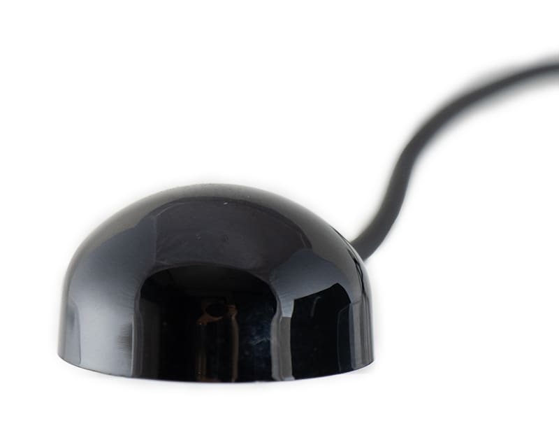 Half spherical black plastic enclosure with short cable attached