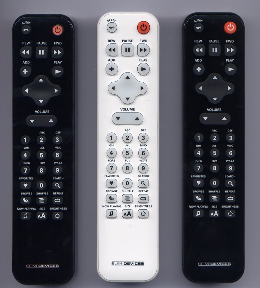 Pictures of three different OEM remote controls.  Two remotes are black and the center remote is white.